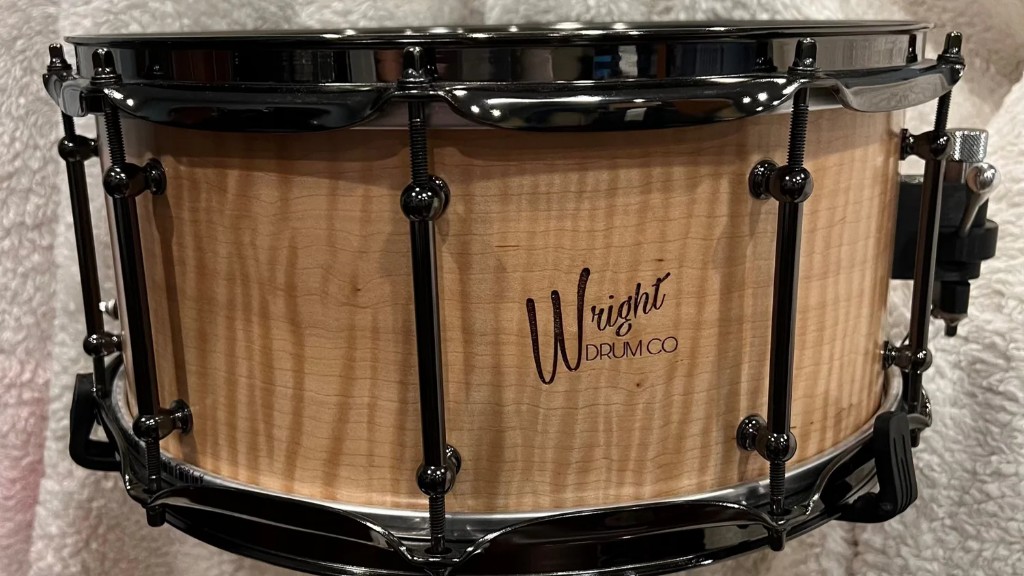Wright Drum Co. 14 x 7 steam-bent curly maple snare with black nickel hardware.